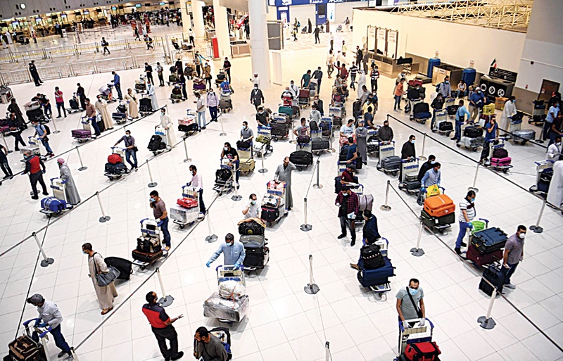 KUWAIT: This May 5, 2020 file photo shows long lines of Egyptian nationals traveling back to their home country after Kuwait opened the door for expatriates wishing to leave to their home countries for good during the aviation closure period. – Photo by Yasser Al-Zayyatn