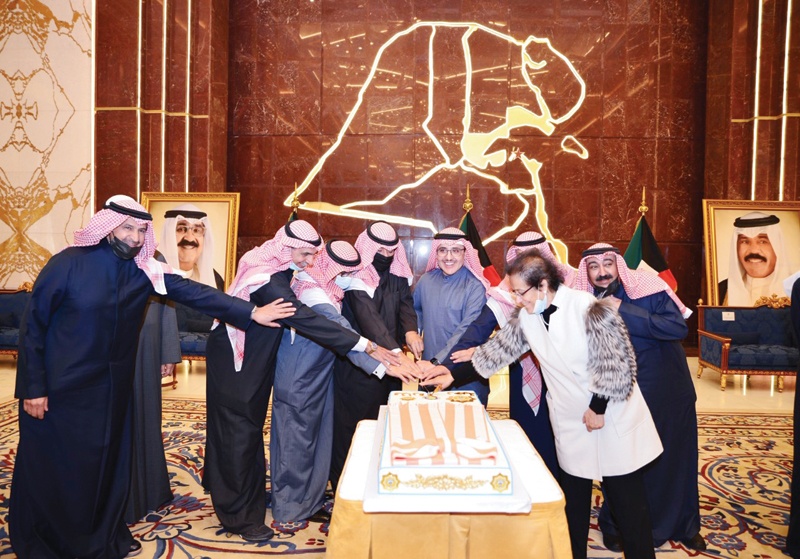 KUWAIT: Foreign Minister Sheikh Dr Ahmad Nasser Al-Mohammad Al-Sabah and other ministry officials cut the cake during the ceremony. - KUNAn
