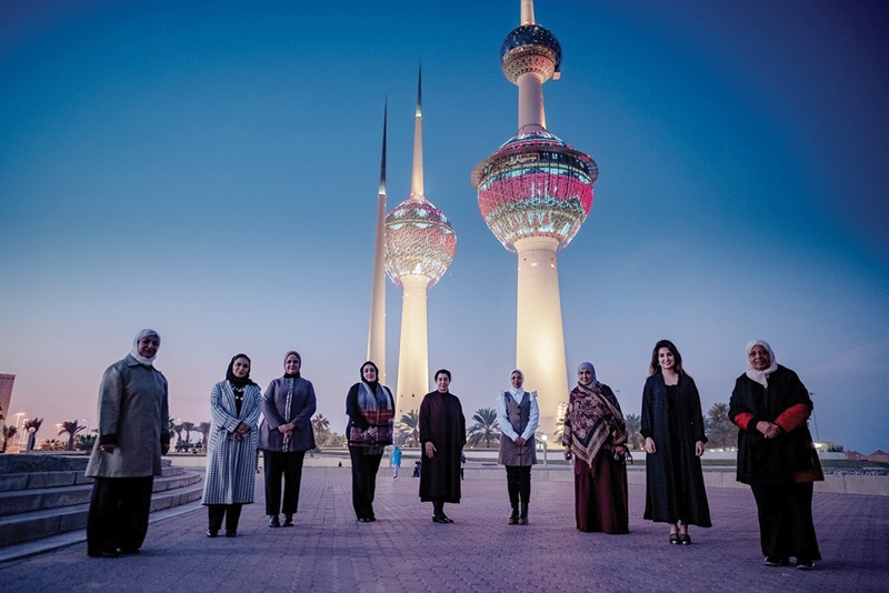 KUWAIT: Sadu House Chairperson Sheikha Bibi Al-Sabah (second from right) in a group photo in front of Kuwait Towers. - KUNAnnnnn