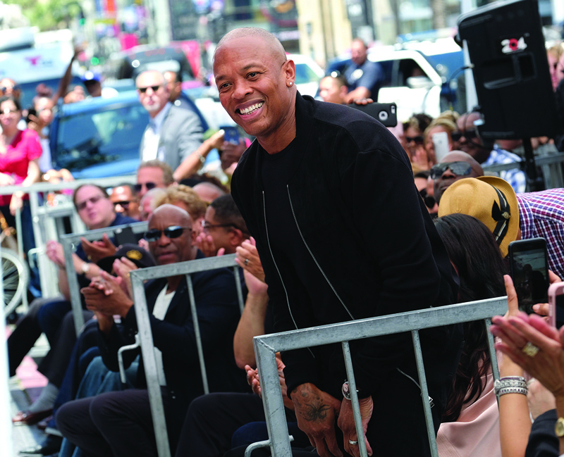 (FILES) In this file photo taken on June 12, 2017 Rapper/producer Dr. Dre attends Ice Cube's Walk of Fame ceremony in Hollywood, California. - Rapper and legendary producer Dr. Dre was in the hospital on January 5, 2021 receiving treatment for a possible brain aneurysm, the Los Angeles Times reported citing sources familiar with his condition. (Photo by Chris DELMAS / AFP)