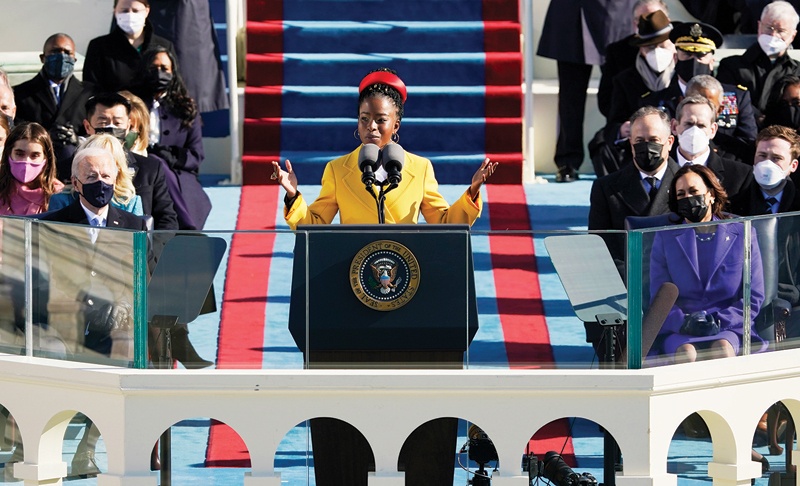 American poet Amanda Gorman reads a poem during the 59th inaugural ceremony on the West Front of the US Capitol on Jan 20, 2021 in Washington. - AFP n