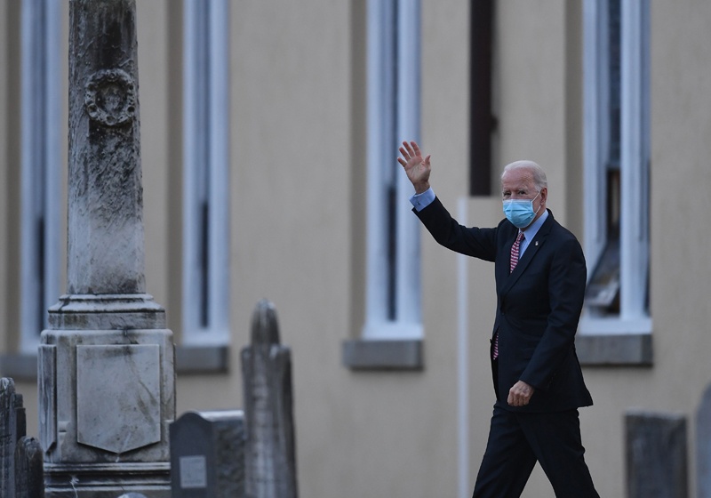 WILMINGTON, Delaware: US President-elect Joe Biden waves as he leaves St Joseph on the Brandywine Roman Catholic Church on Saturday. – AFP  n