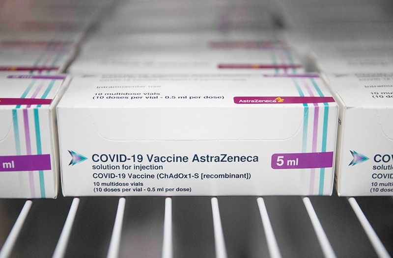 BRISTOL: Boxes of vials of the Oxford/AstraZeneca COVID-19 vaccine are seen in a refrigerator at Ashton Gate Stadium. — AFP n