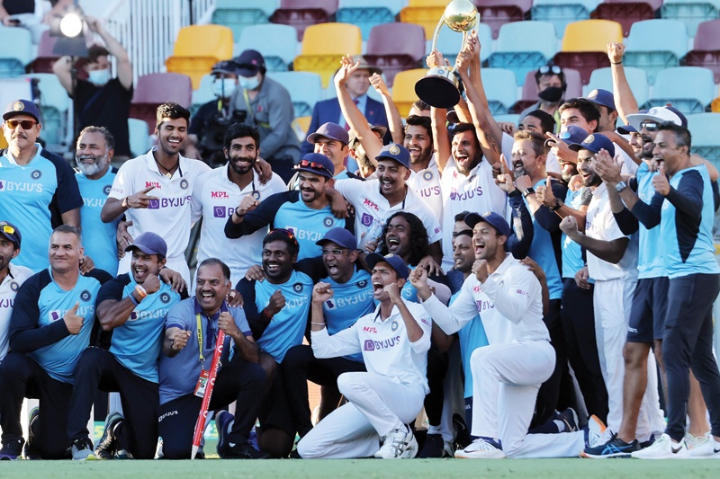 BRISBANE: India's players and officials celebrate with the winning trophy at the end of the fourth cricket Test match between Australia and India at The Gabba in Brisbane yesterday. - AFPn