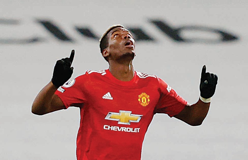 LONDON: Manchester United's French midfielder Paul Pogba celebrates scoring their second goal during the English Premier League match between Fulham and Manchester United at Craven Cottage on Wednesday. - AFP n