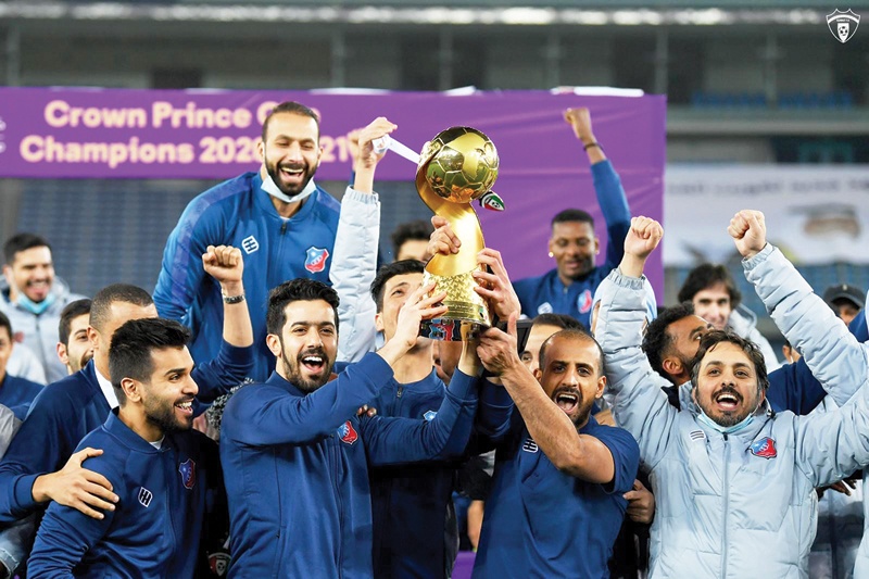 KUWAIT: Kuwait Club players celebrate with the championship trophy.n