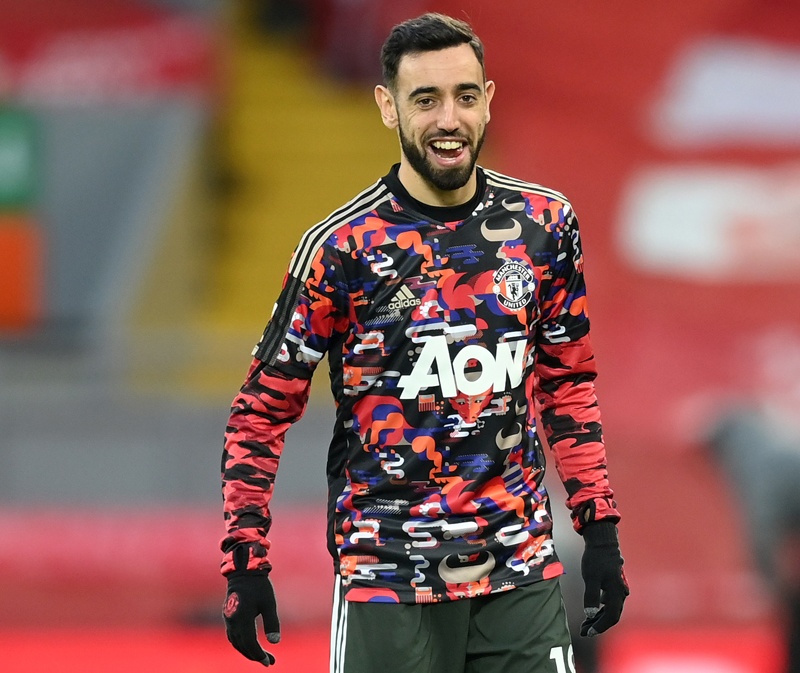 LIVERPOOL: Manchester United's Portuguese midfielder Bruno Fernandes warms up ahead of the English Premier League football match between Liverpool and Manchester United at Anfield in Liverpool, north west England on January 17, 2021. — AFPn