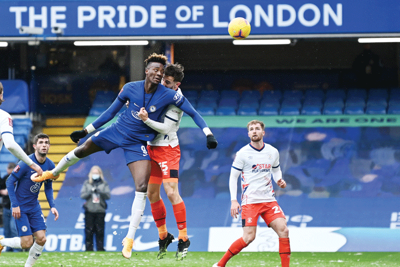 LONDON: Chelsea's English striker Tammy Abraham (center left) heads home their second goal during the English FA Cup fourth round football match between Chelsea and Luton Town at Stamford Bridge in London yesterday. - AFPn