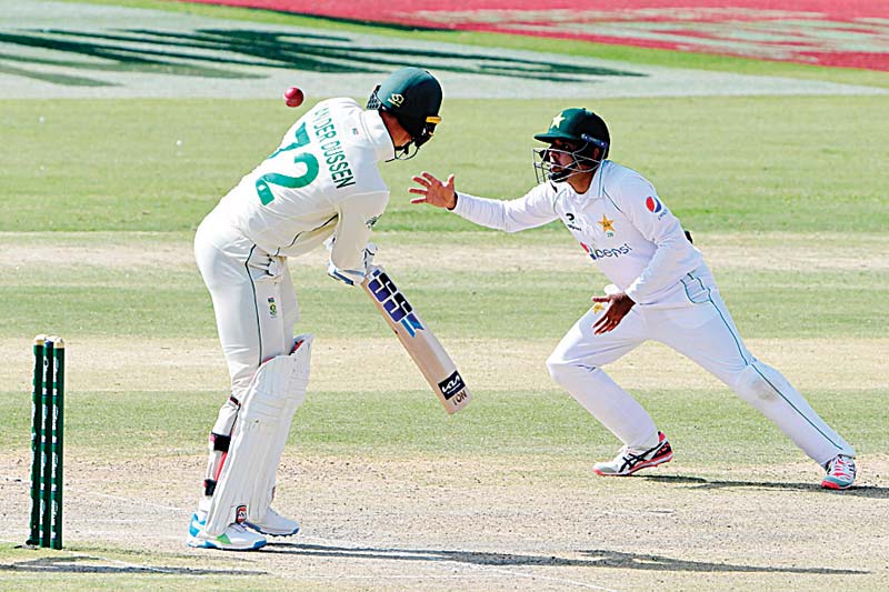 KARACHI: Pakistan's Abid Ali tries to field the ball played by South Africa's Rassie van der Dussen during the third day of the first cricket Test match between Pakistan and South Africa at the National Stadium yesterday. – AFP n