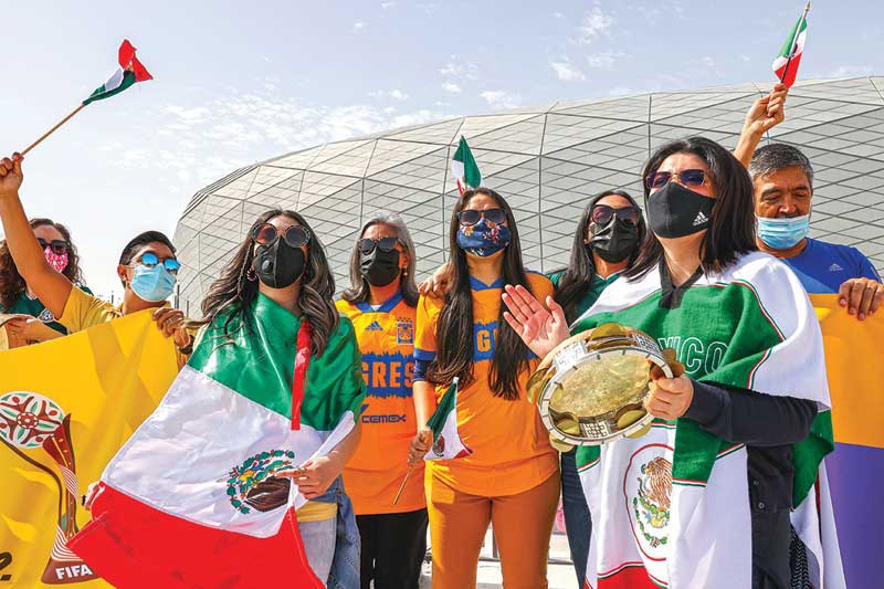 AR-RAYYAN: Supporters of Mexico's Tigres UANL football club, clad in masks due to the COVID-19 coronavirus pandemic, gather to support their team at an event for fans outside Education City Stadium in the Qatari city of Ar-Rayyan yesterday, ahead of their match against Ulsan Hyundai FC the following week. - AFPn