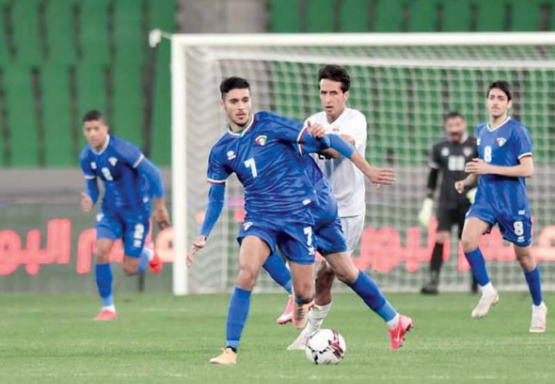 BASRA: Players vie for the ball during a friendly match between Kuwait and Iraq at the Jidhe Al-Nakhlah Stadium on Wednesday. - KUNA n