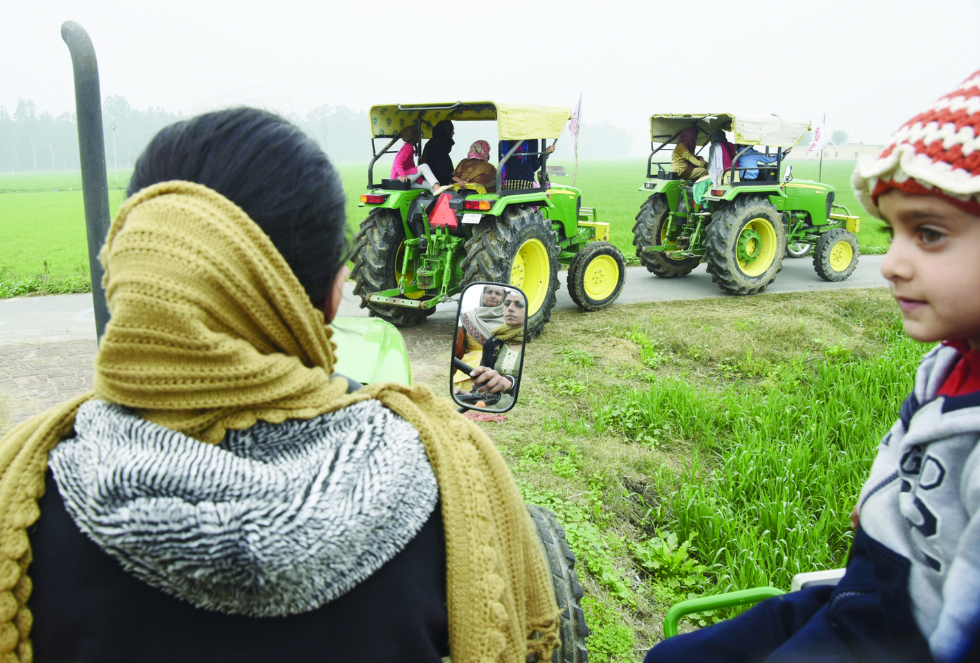 AMRITSAR: Wives and daughters of farmers practice driving tractors to take part in Women Tractor Rally on the occasion of Republic Day in India's capital Delhi to protest against the central government's recent agricultural reforms, on the outskirts of Amritsar. - AFPn