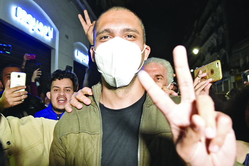 ALGIERS: Algerian journalist Khaled Drareni is greeted by supporters upon his arrival to his home in his capital Algiers, following his release from the Kolea prison. - AFPn