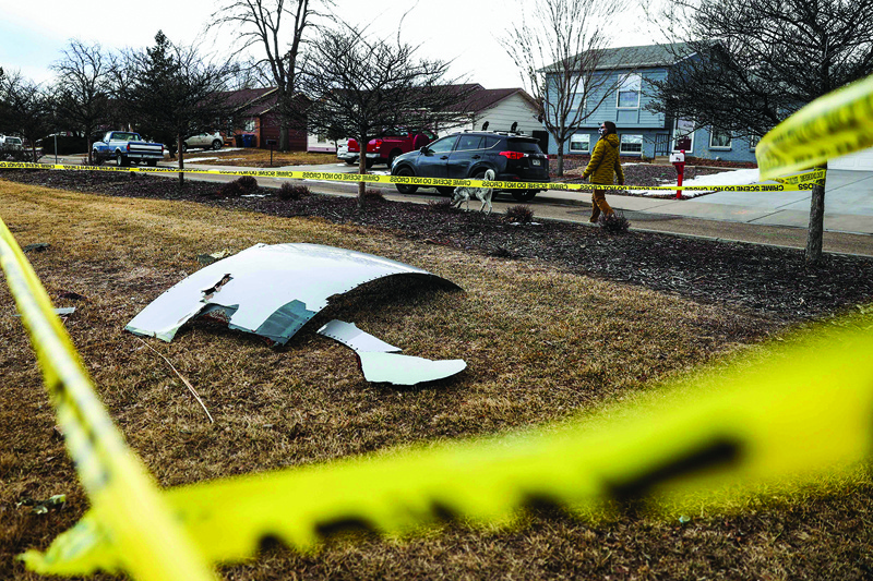 BROOMFIELD, Colorado:  In this file photo pieces of an airplane engine from Flight 328 sit scattered in a neighborhood in Broomfield, Colorado.-AFP n