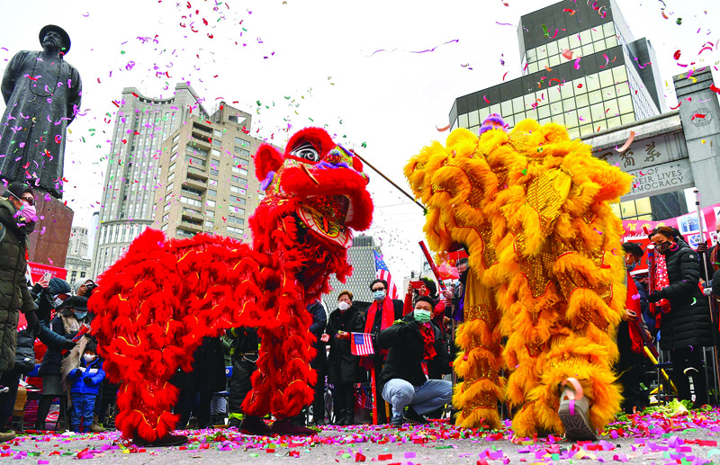 NEW YORK: People celebrate the Lunar New Year holiday in Chinatown on February 12, 2021 in New York City. -AFP n