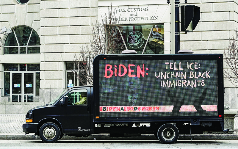 WASHINGTON, DC: An LED truck displaying messages expressing concern over the continuing mass deportations of Black immigrants drives past the office of US Customs and Border Protection prior to a #BidenAlsoDeports rally in Washington, DC. - AFPn