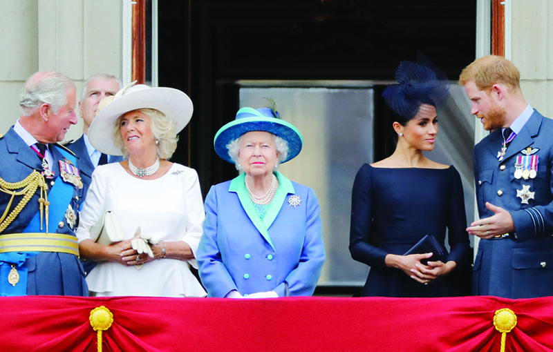 LONDON: In this file photo (From left) Britain’s Prince Charles, Prince of Wales, Britain’s Camilla, Duchess of Cornwall, Britain’s Queen Elizabeth II, Britain’s Meghan, Duchess of Sussex and Britain’s Prince Harry, Duke of Sussex, stand on the balcony of Buckingham Palace to watch a military fly-past to mark the centenary of the Royal Air Force (RAF).  — AFP