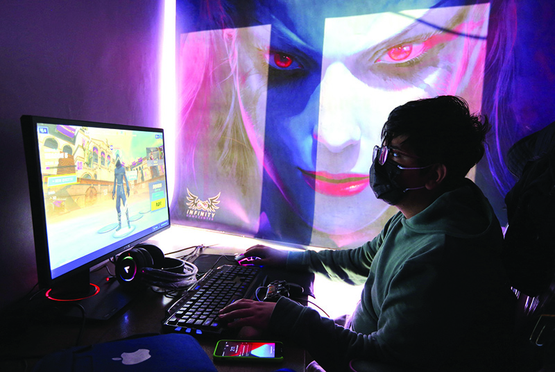 A youth plays an online multiplayer game at an internet cafe in Iran's capital Tehran.-AFPn