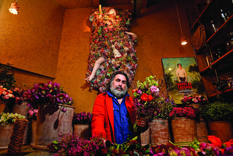 French florist artist Thierry Boutemy poses for portrait pictures in his atelier and flower shop, during an interview with AFP, in Brussels.-AFP n