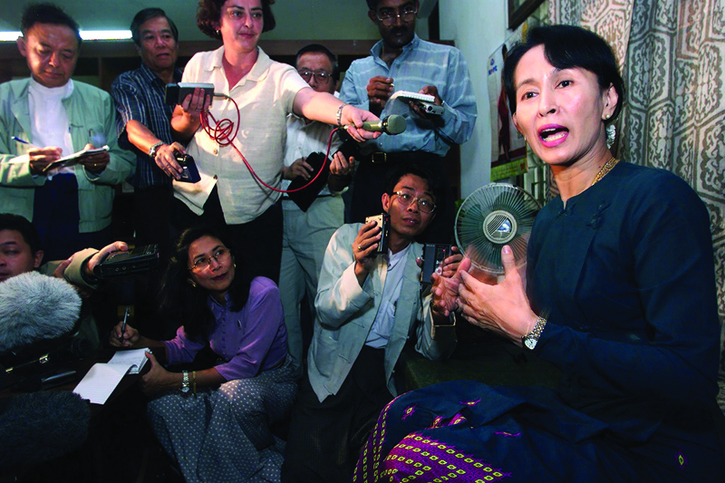 YANGON: In this file photo taken on February 25, 1999, Myanmar opposition leader and Nobel Peace Price laureate Aung San Suu Kyi (right) gestures while addressing an impromptu press conference in Yangon. -AFP n