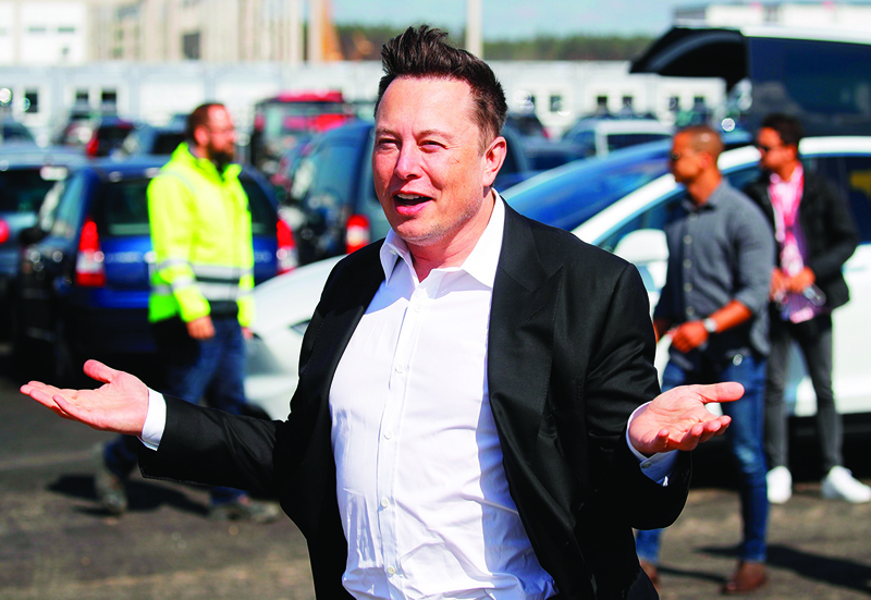 In this file photo Tesla CEO Elon Musk gestures as he arrives to visit the construction site of the future US electric car giant Tesla in Grünheide near Berlin. - AFPn