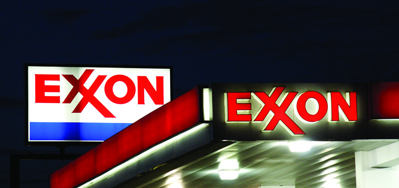 (FILES) This file photograph taken on September 21, 2008, shows an Exxon sign at a petrol station in Manassas, Virginia. - Exxon Mobil closed the books on a terrible 2020 on February 2, 2021, reporting losses in the fourth-quarter and for the full year in the wake of lower oil prices with Covid-19. The big US oil company reported a fourth-quarter loss of $20.7 billion following huge write-offs. That took the company's loss for all of 2020 to $22.4 billion, compared with $14.3 billion in profits in 2019. Exxon Mobil also unveiled plans for additional spending cuts of $3 billion in annual expenses expected by 2023, its latest belt-tightening move amid the industry downturn. (Photo by KAREN BLEIER / AFP)