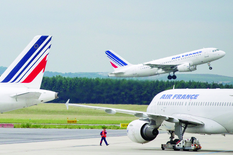 PARIS: This file photo shows Air France planes at Roissy-Charles de Gaulle airport in Roissy-en-France, outside Paris. - AFPn