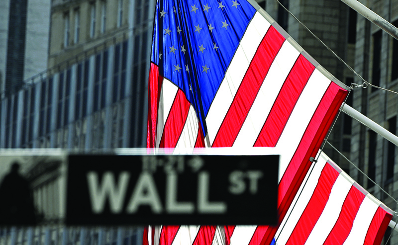 A Wall Street sign at the New York Stock Exchange (NYSE) in New York City. - AFP