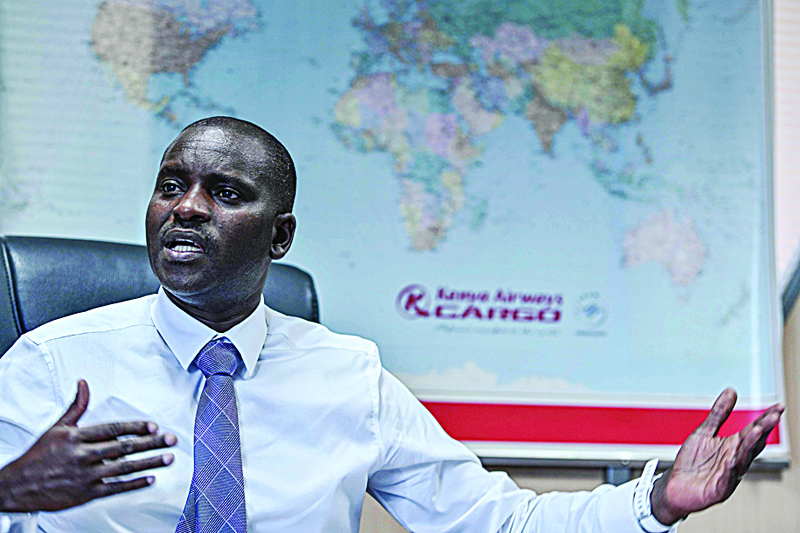 NAIROBI: Kenya Airways' Commercial Cargo Manager Peter Musola gives an interview at the airline's import handling facility at Jomo Kenyatta International Airport on Feb 11, 2021. - AFP n