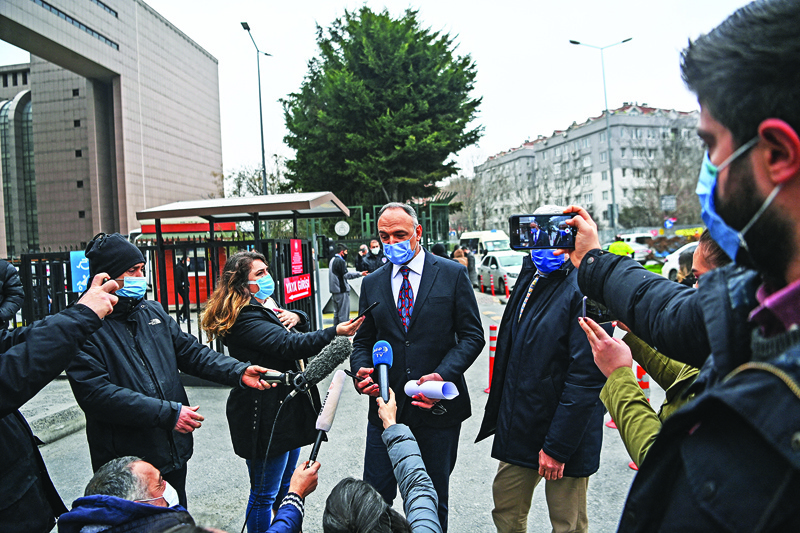 ISTANBUL: Pilot Noyan Pasin (center) and his lawyer Erem Yucel (right) speak to media in front of the Bakirkoy courthouse in Istanbul, yesterday after a verdict trial against four pilots, two flight attendants and a private airline official accused of smuggling former Nissan Motor Co chairman Carlos Ghosn out of Japan. - AFPn