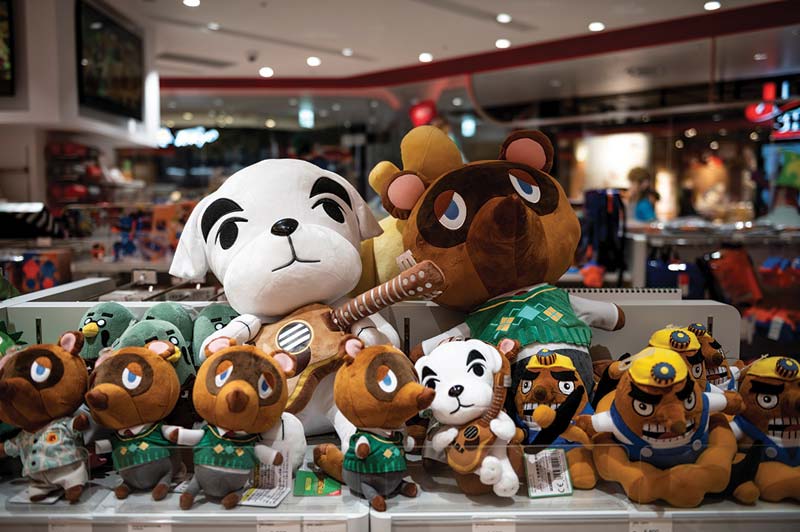TOKYO: Stuffed animal toys from the Animal Crossing series video game are pictured in a Nintendo store in Tokyo yesterday as the company announced a gain of 2.51 percent. - AFPn