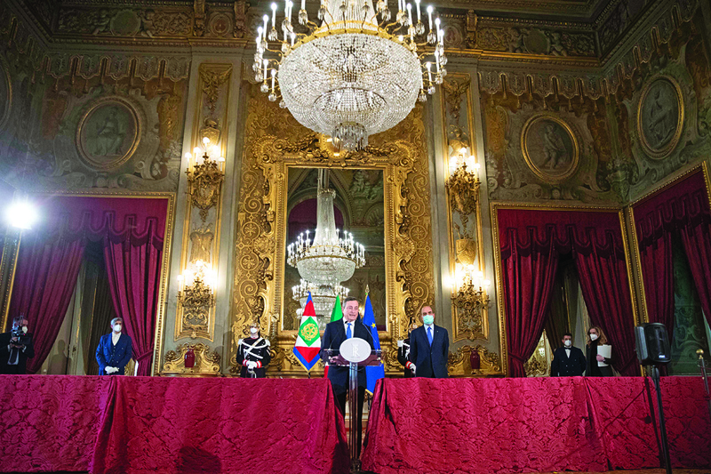 ROME: Former head of the ECB Mario Draghi (center) gives a speech after a meeting with the Italian president, at the Quirinal palace in Rome, yesterday. - AFPn