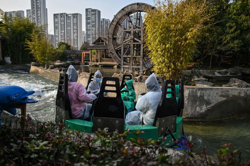 WUHAN: Visitors go on one of the water rides at an amusement park in Wuhan in China's central Hubei province yesterday.-AFP n