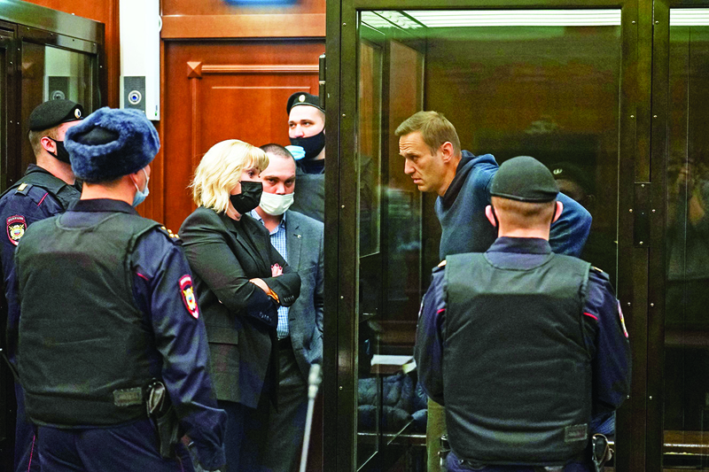 MOSCOW : Russian opposition leader Alexei Navalny, charged with violating the terms of a 2014 suspended sentence for embezzlement, listens to his lawyers during a court hearing in Moscow yesterday.-AFP n