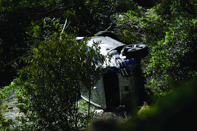 LOS ANGELES: The vehicle driven by golfer Tiger Woods lies on its side in Rancho Palos Verdes on Tuesday after a rollover accident. - AFP n