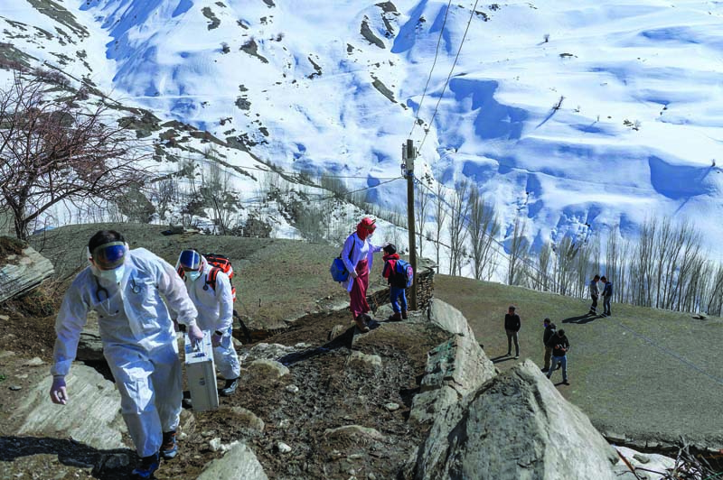 GUNEYYAMAC, Turkey: Doctors and nurses from the Bahcesaray public hospital vaccination team arrive at this village to vaccinate elderly residents on Feb 15, 2021. – AFP n