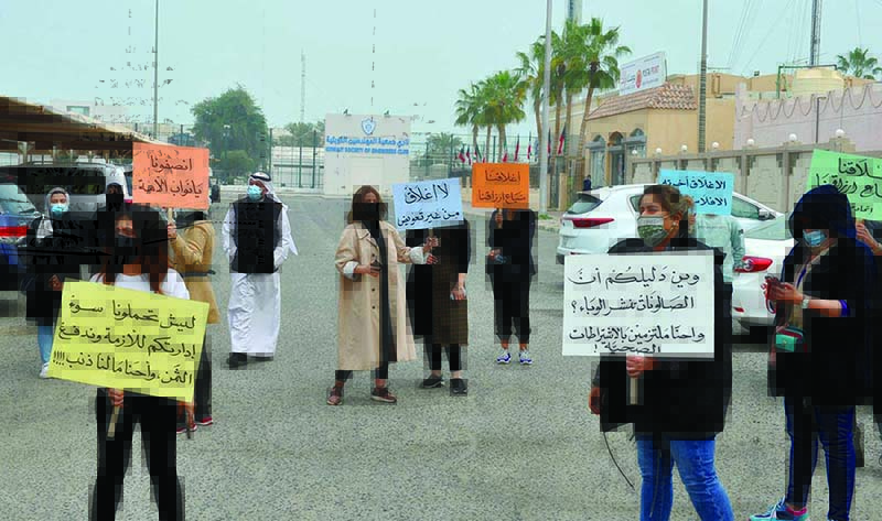 KUWAIT: Salon owners protest yesterday against the indefinite closure of salons and barbershops from today as part of the government’s measures to fight the spread of COVID-19. — Photo by Fouad Al-Shaikh