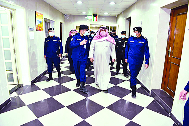 KUWAIT: Interior Minister Sheikh Thamer Ali Sabah Al-Salem Al-Sabah (center) is seen during the tour. - KUNAn