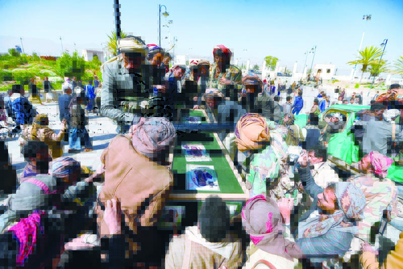 SANAA: Fighters loyal to Yemen's Houthi rebels surround the coffins of fellow combatants killed in battles with government troops during a mass funeral ceremony at the capital Sanaa's Al-Saleh mosque yesterday.-AFPn