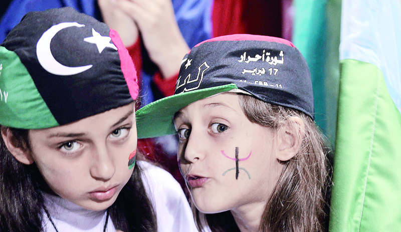 TRIPOLI: In this file photo taken on September 27, 2011, young Libyan Berber girls attend an Amazigh festival in the capital Tripoli. Ten years after Libya's NATO-backed uprising ousted and killed dictator Muammar Gaddafi, the country remains wracked by conflict and chaos.-AFPn