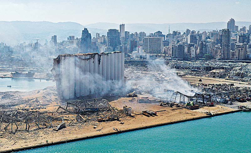 BEIRUT: This file aerial photo shows the massive damage done to Beirut port's grain silos (center) and the area around it, one day after a mega-blast tore through the harbor in the heart of the Lebanese capital.-AFP n