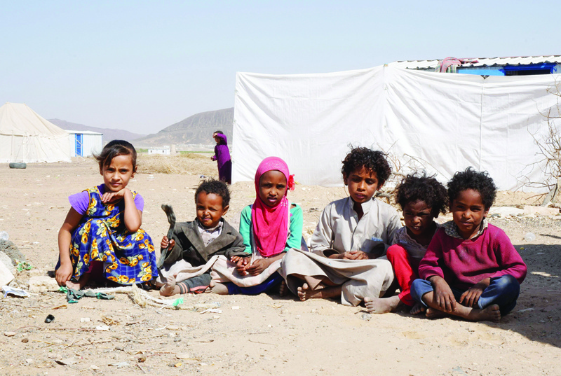 MARIB, Yemen: Yemeni children sit at the Jaw Al-Naseem camp for internally displaced people on the outskirts of the northern city of Marib, in the Saudi-backed Yemeni government's last northern bastion.-AFP n