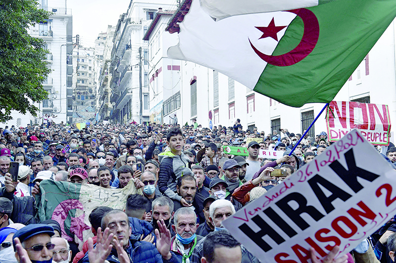 ALGIERS: Algerian anti-government protesters take part in a demonstration in the capital on Friday. —AFP