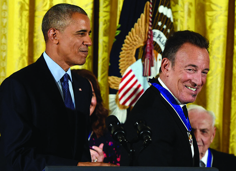 In this file photo US President Barack Obama looks on after presenting musician Bruce Springsteen with the Presidential Medal of Freedom.-AFP n