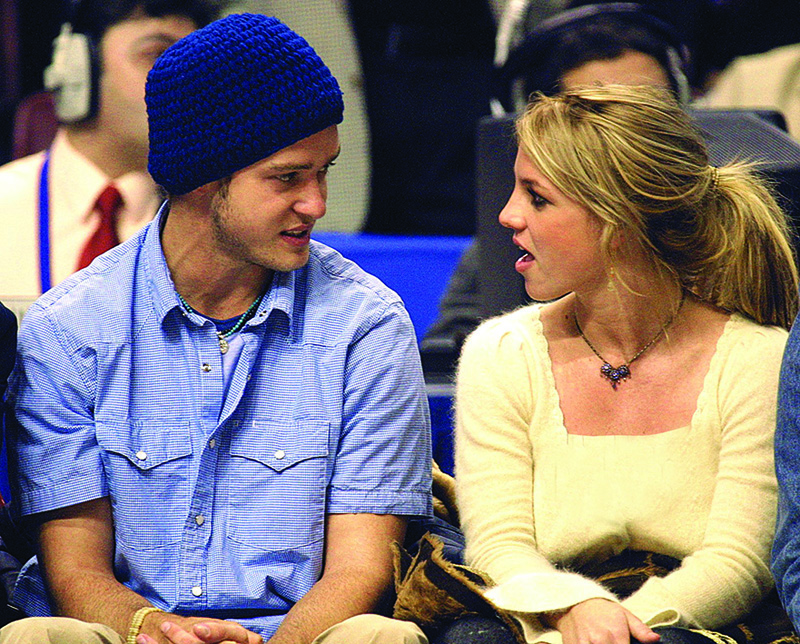 In this file photo Pop superstars Britney Spears (right) and boyfriend Justin Timberlake (left) talk as they sit courtside at the NBA All-Star Game in Philadelphia.—AFP n