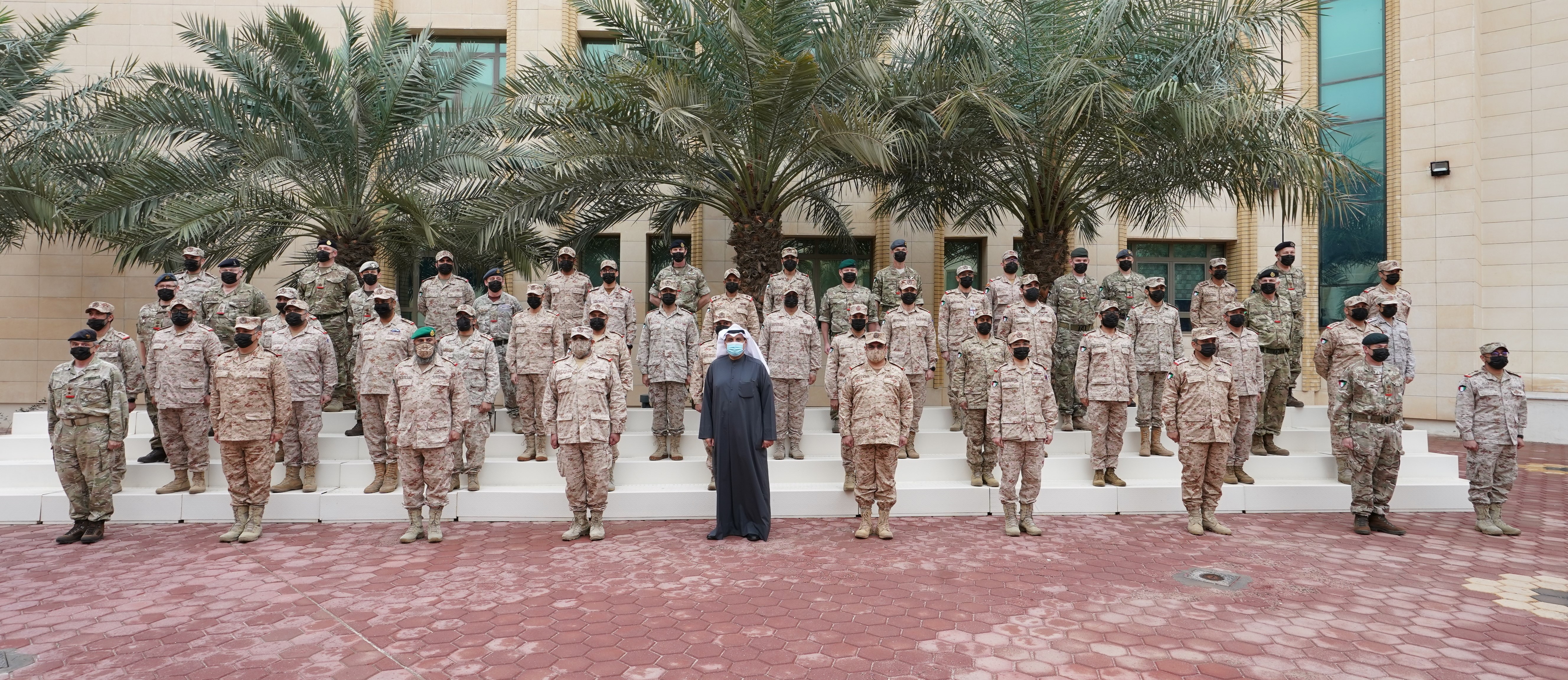 KUWAIT: Deputy Prime Minister and Minister of Defense Sheikh Hamad Jaber Al-Ali Al-Sabah in a group photo during his visit to the Mubarak Al-Abdullah Joint Command and Staff College. - Defense Ministry photosn