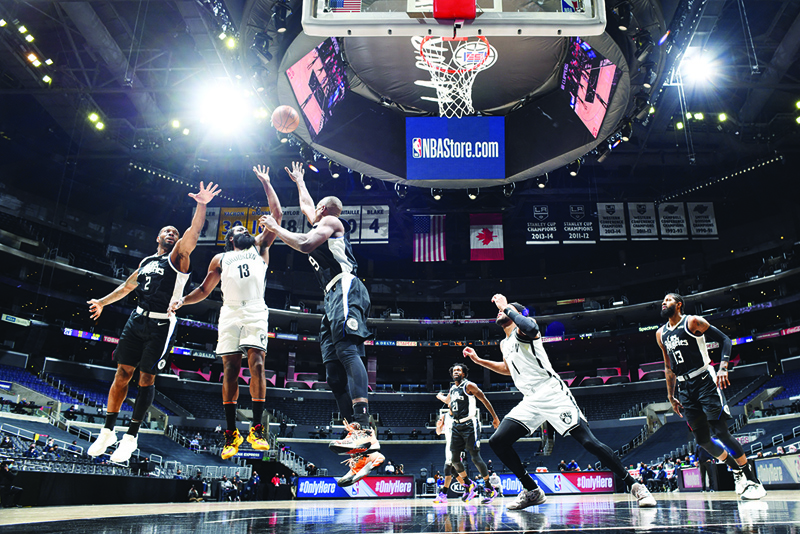 LOS ANGELES: James Harden #13 of the Brooklyn Nets shoots the ball during the game against the LA Clippers on Sunday at STAPLES Center in Los Angeles, California. – AFPn