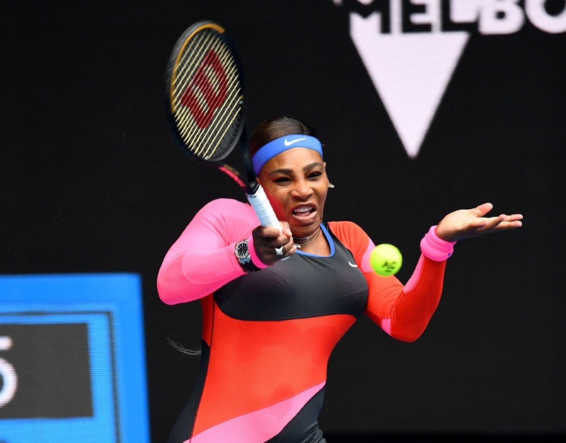MELBOURNE: Serena Williams of the US hits a return against Germany's Laura Siegemund during their women's singles match on day one of the Australian Open tennis tournament in Melbourne yesterday. – AFPn