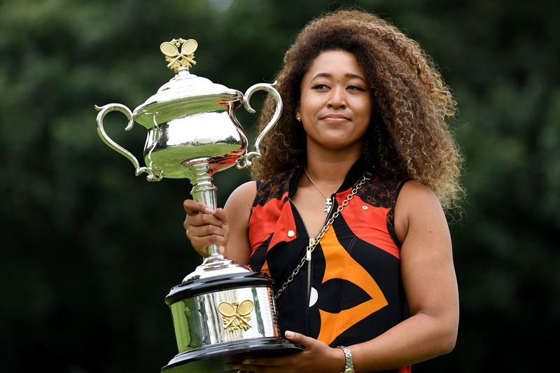 MELBOURNE: Japan's Naomi Osaka poses with the 2021 Australian Open winner's trophy at the Government House in Melbourne yesterday, following her victory over Jennifer Brady of the US in the women's singles final of the tennis tournament. - AFPn