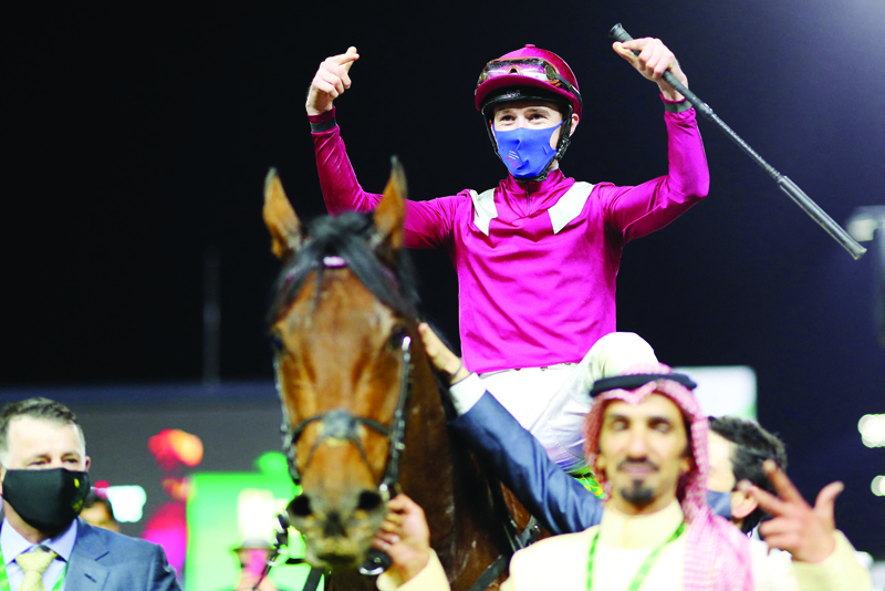 RIYADH: This handout photo provided by the Jockey Club of Saudi Arabia shows winner of the Saudi Cup, Mishriff ridden by David Egan, the world's richest with a $20 million prize fund in Riyadh, on Saturday. - AFPn
